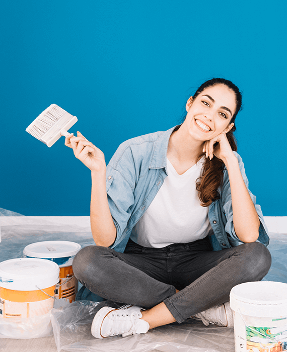 Professional painter with paint buckets